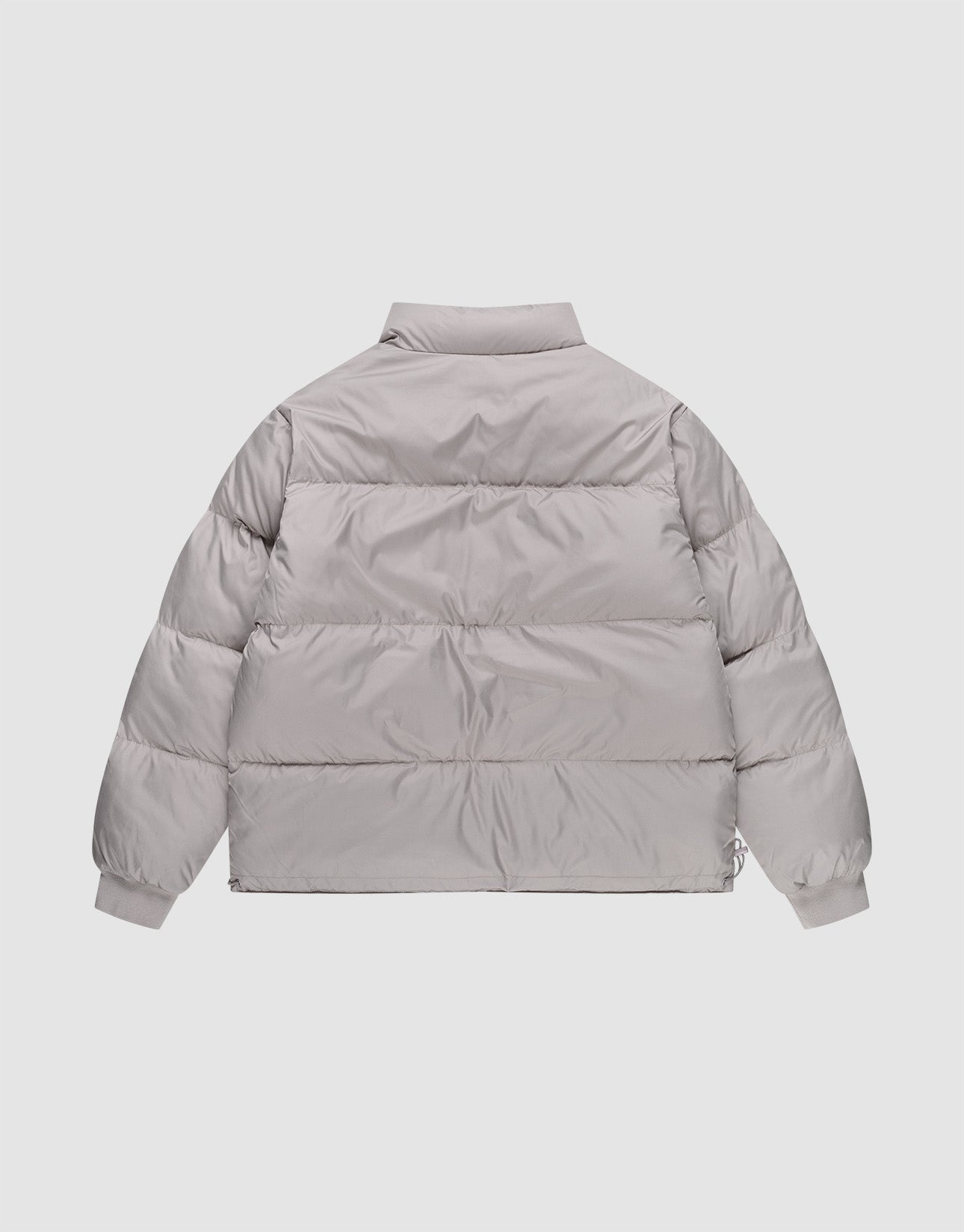 The LFDY Puffer Jacket by LIVE FAST DIE YOUNG, in light gray with an oversize fit, features horizontal quilting, long sleeves, and a high collar. Displayed flat from the back.