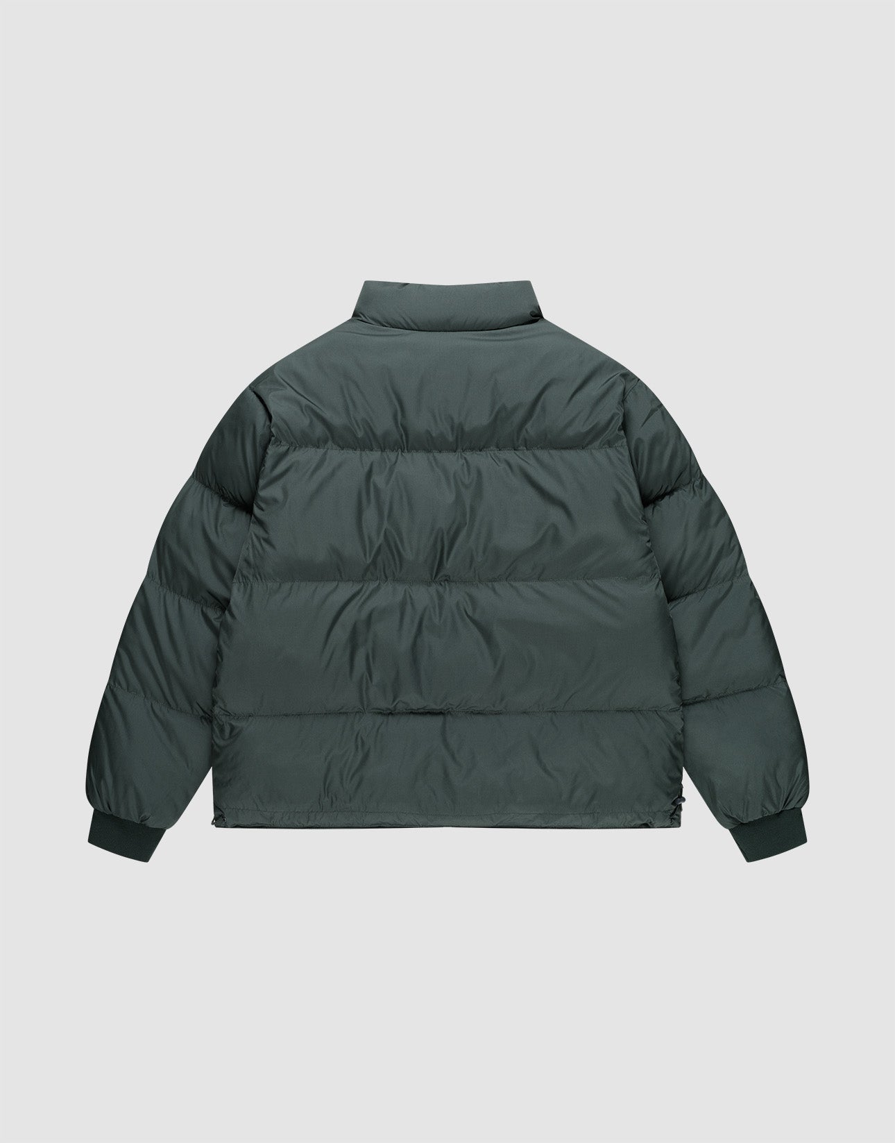 The LIVE FAST DIE YOUNG LFDY Puffer Jacket is a dark green oversize fit with horizontal quilting, high collar, and ribbed cuffs, shown from the back on a plain light background.