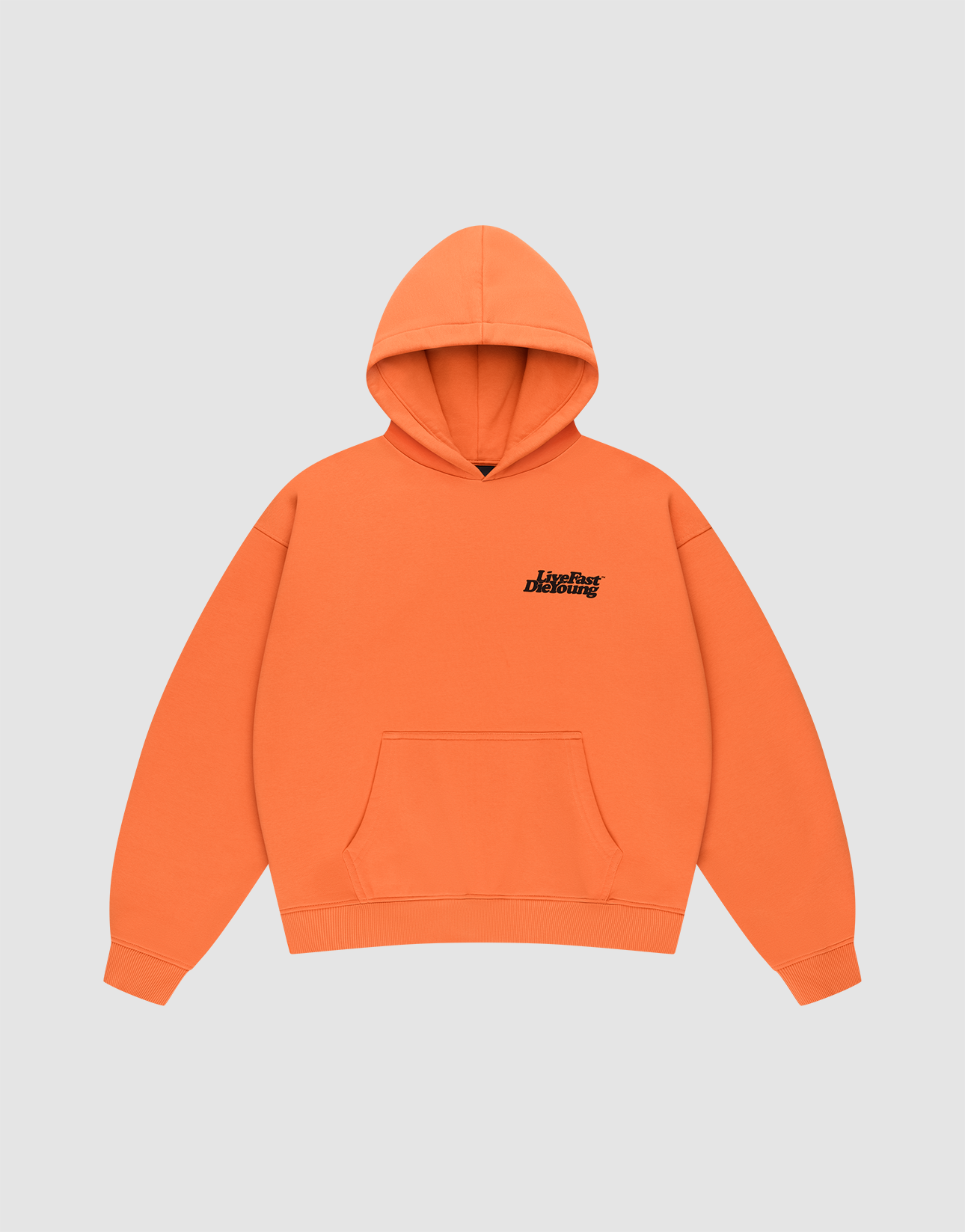 The LIVE FAST DIE YOUNG Basic Orange Hooded is an oversize fit hoodie in cotton-polyester with a front pocket, small black "Liberal Designer" text on the chest, and subtle prints on front and back. Shown on a plain light gray background.