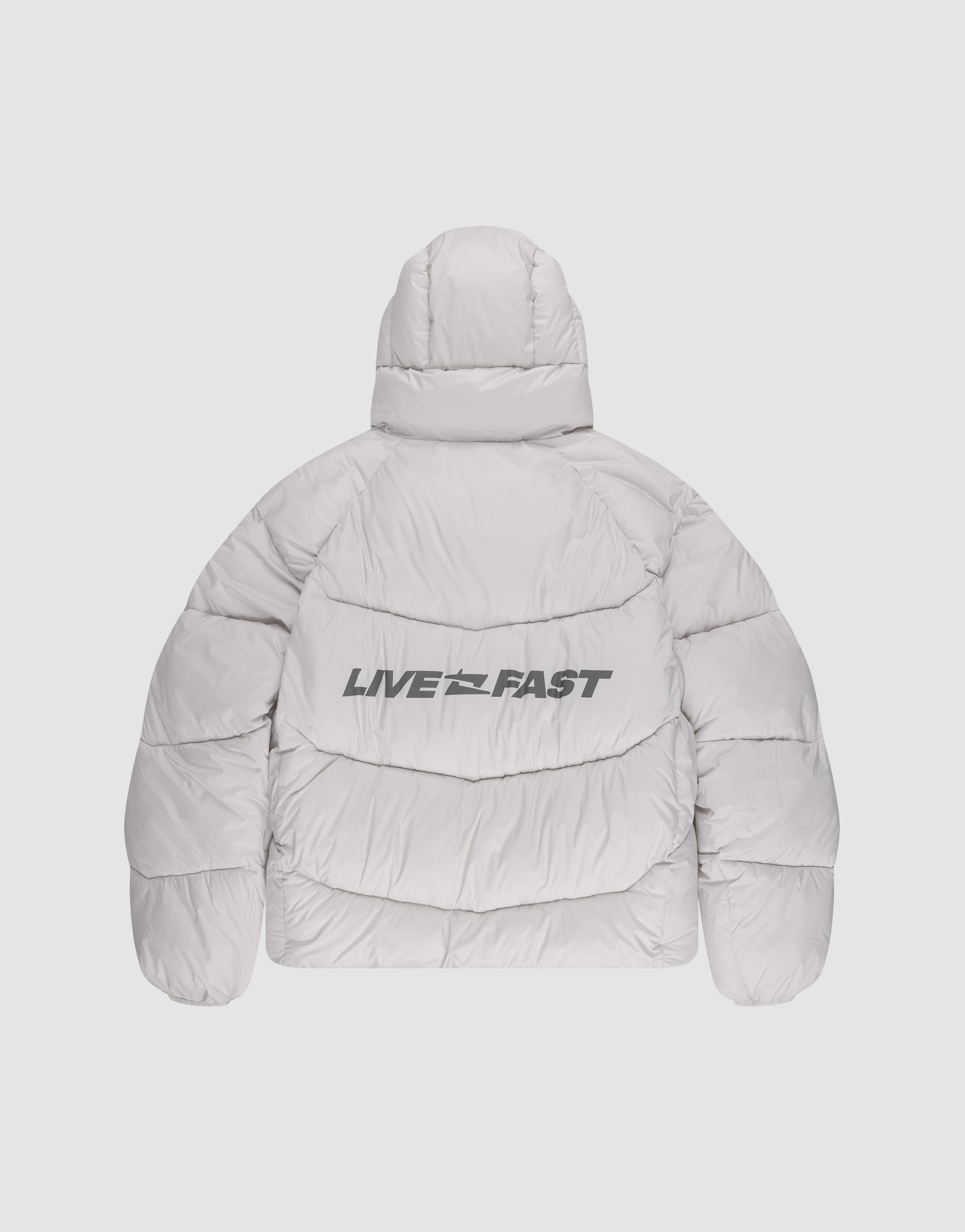 The Live Fast Puffer Jacket by LIVE FAST DIE YOUNG is a light gray, hooded jacket shown from the back with a reflective LIVE FAST print in bold black letters across the back.