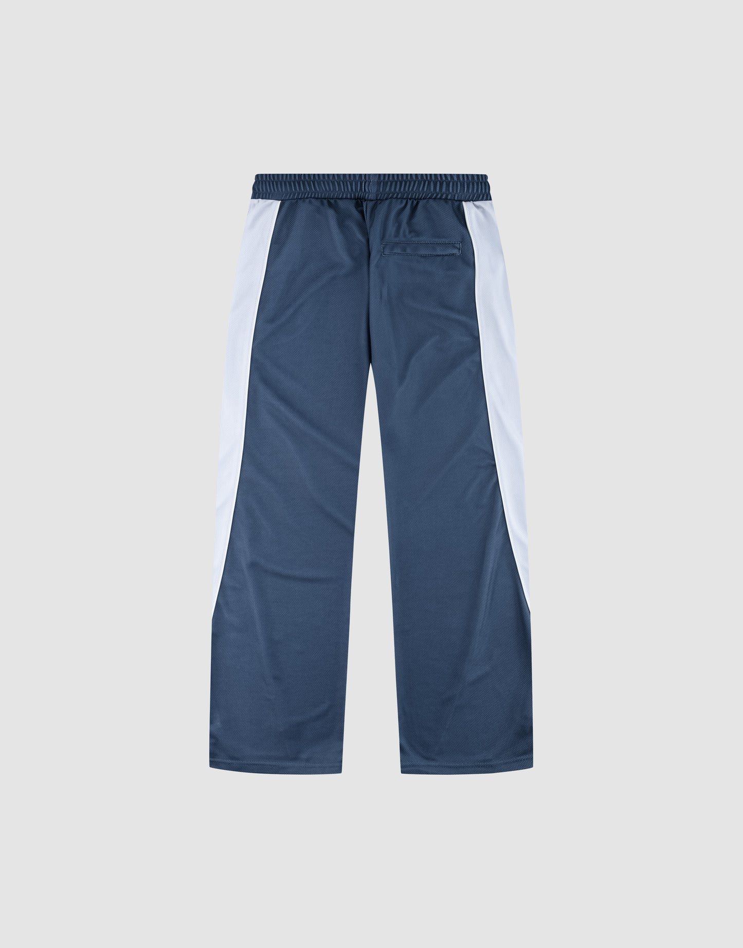 The LFDY DY Trackpants by LIVE FAST DIE YOUNG feature blue polyester in a wide fit with white side panels, an elastic waistband, and a single back pocket, shown flat on a light grey background.