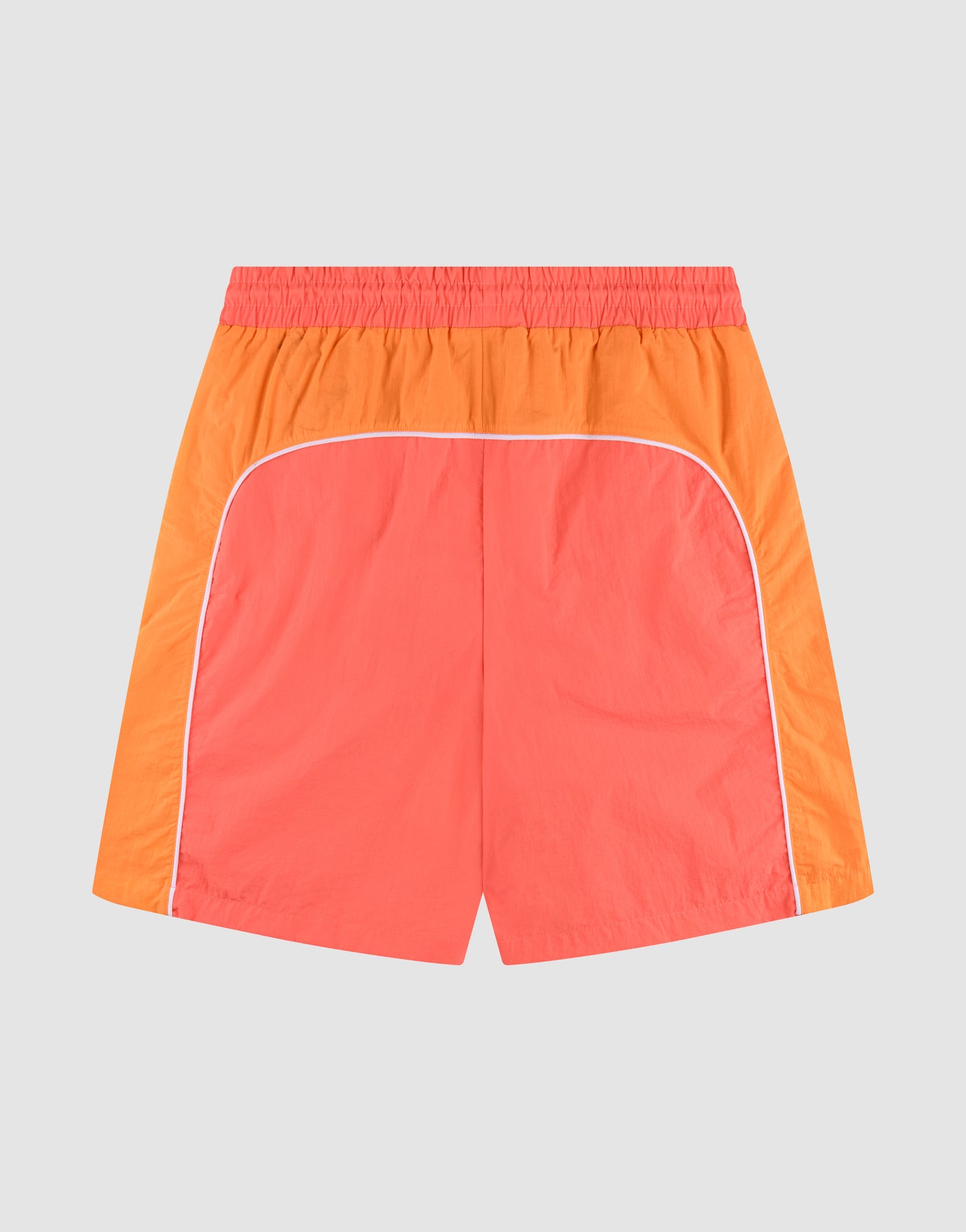 LIVE FAST DIE YOUNG Beach Shorts in coral red and orange feature side pockets, white piping, an elastic waistband, and a color block design, shown on a plain light background.