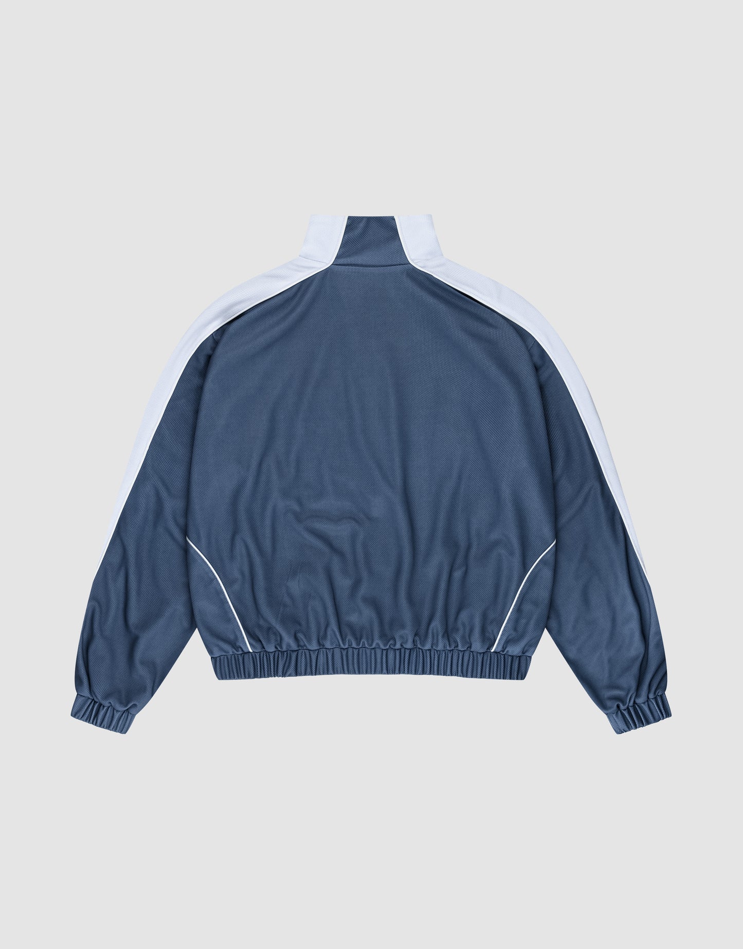 The LIVE FAST DIE YOUNG LFDY Arch Trackjacket in blue polyester features white stripes on the shoulders and sleeves, an oversize fit, and elastic cuffs and hem, shown laid flat from the back on a light gray background.