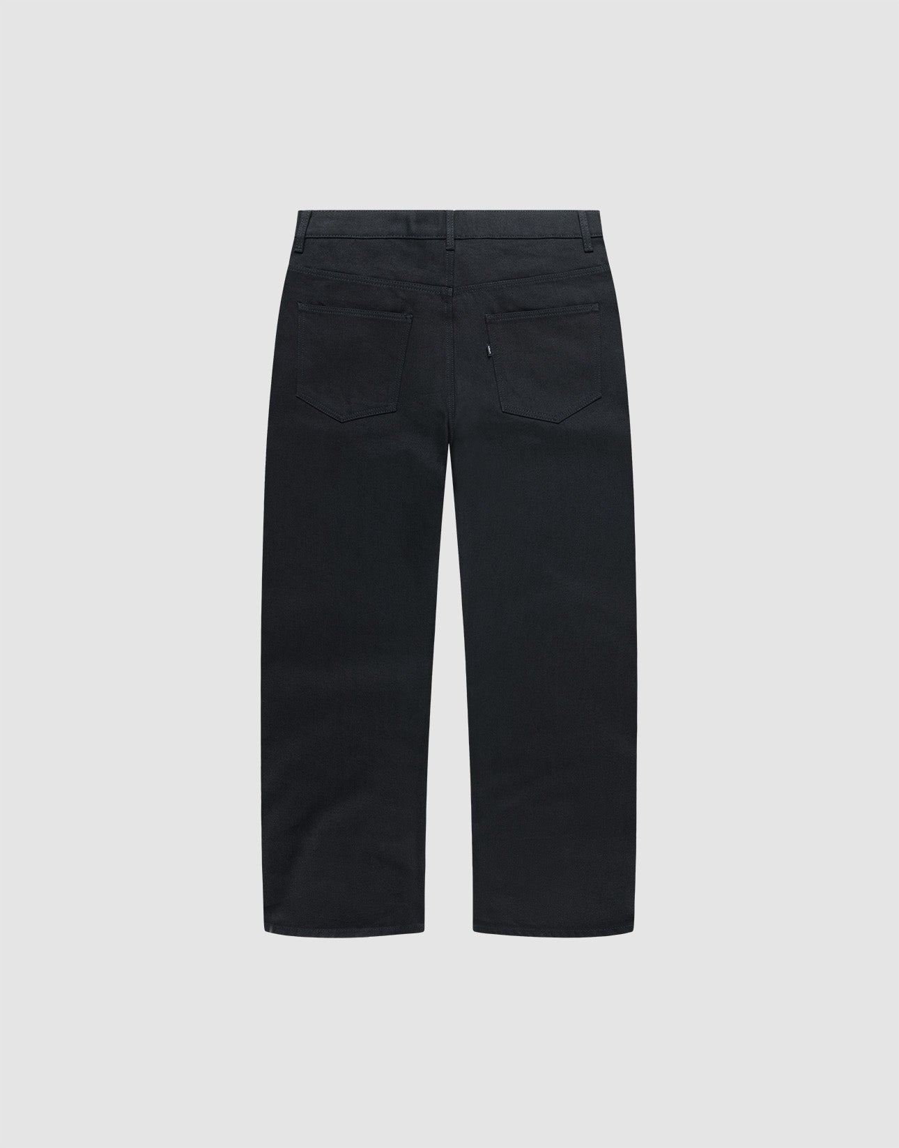 Back view of LIVE FAST DIE YOUNG's LFDY Baggy Denim in black, straight-leg and baggy fit, with two back pockets and belt loops, displayed against a plain light background.