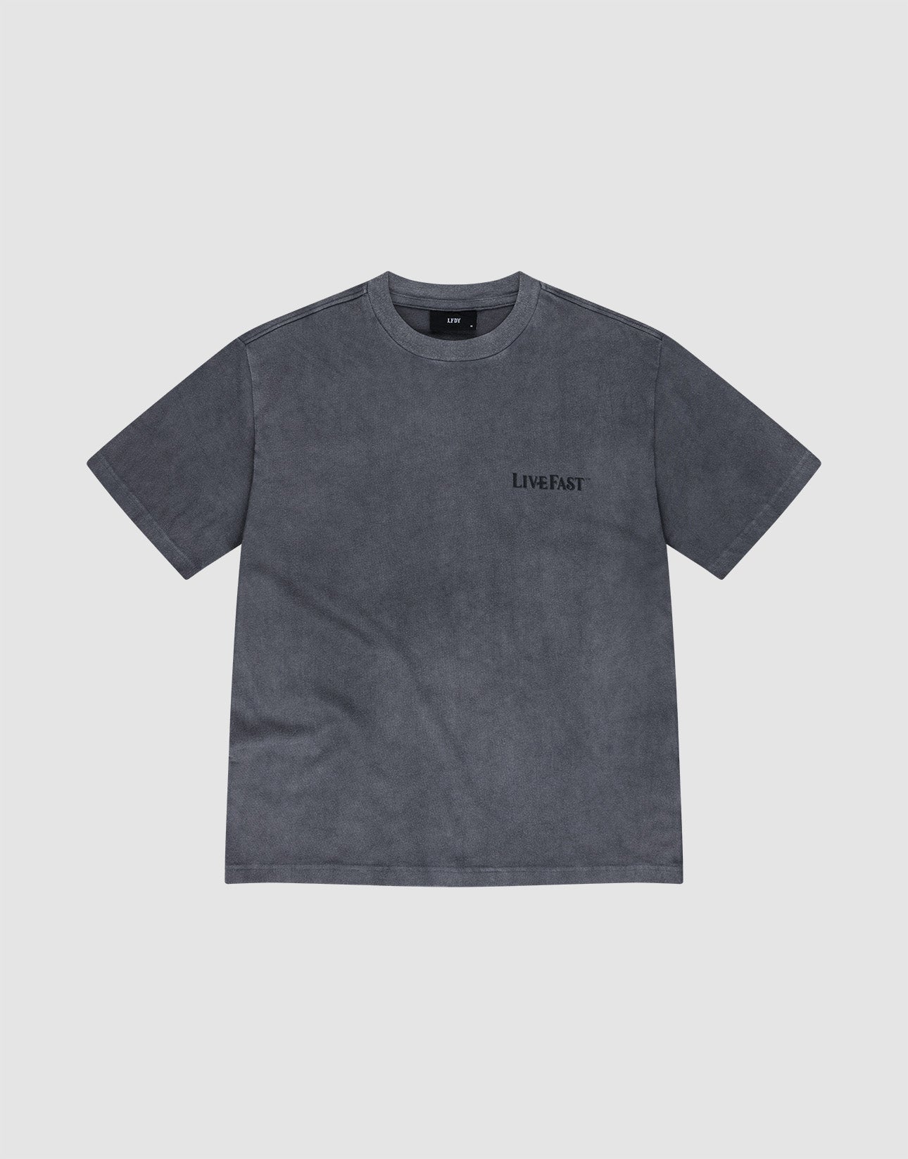 The LFDY Loyal Tee by LIVE FAST DIE YOUNG is a plain, short-sleeved, charcoal gray shirt featuring small black "LIVE FAST" text on the left chest, shown against a light gray background.