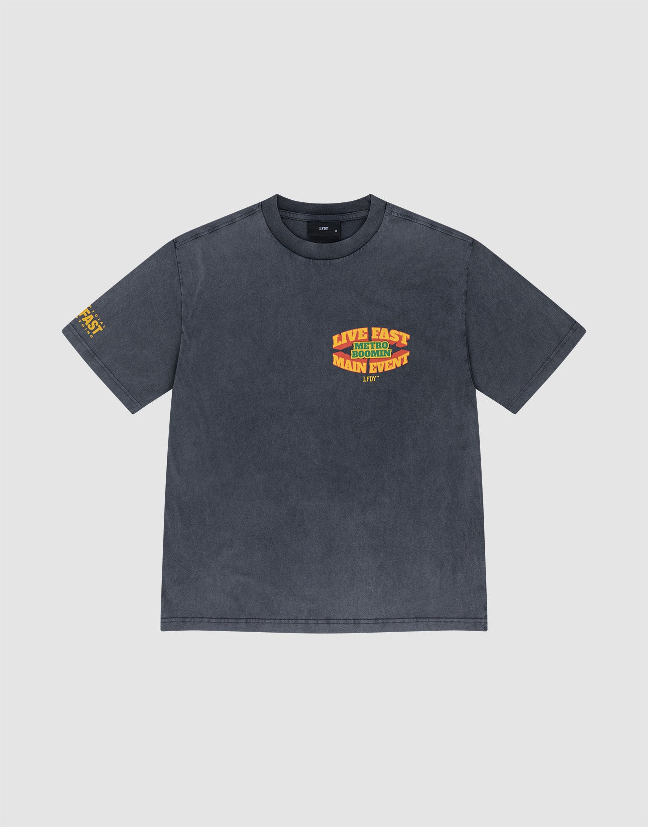 The LFDY Metro Boomin Tee by LIVE FAST DIE YOUNG is a faded black, 100% Baumwolle oversized short-sleeve shirt with yellow and red "LIVE FAST MAIN EVENT" chest text, sleeve details, bold front and back prints, shown on a light background.