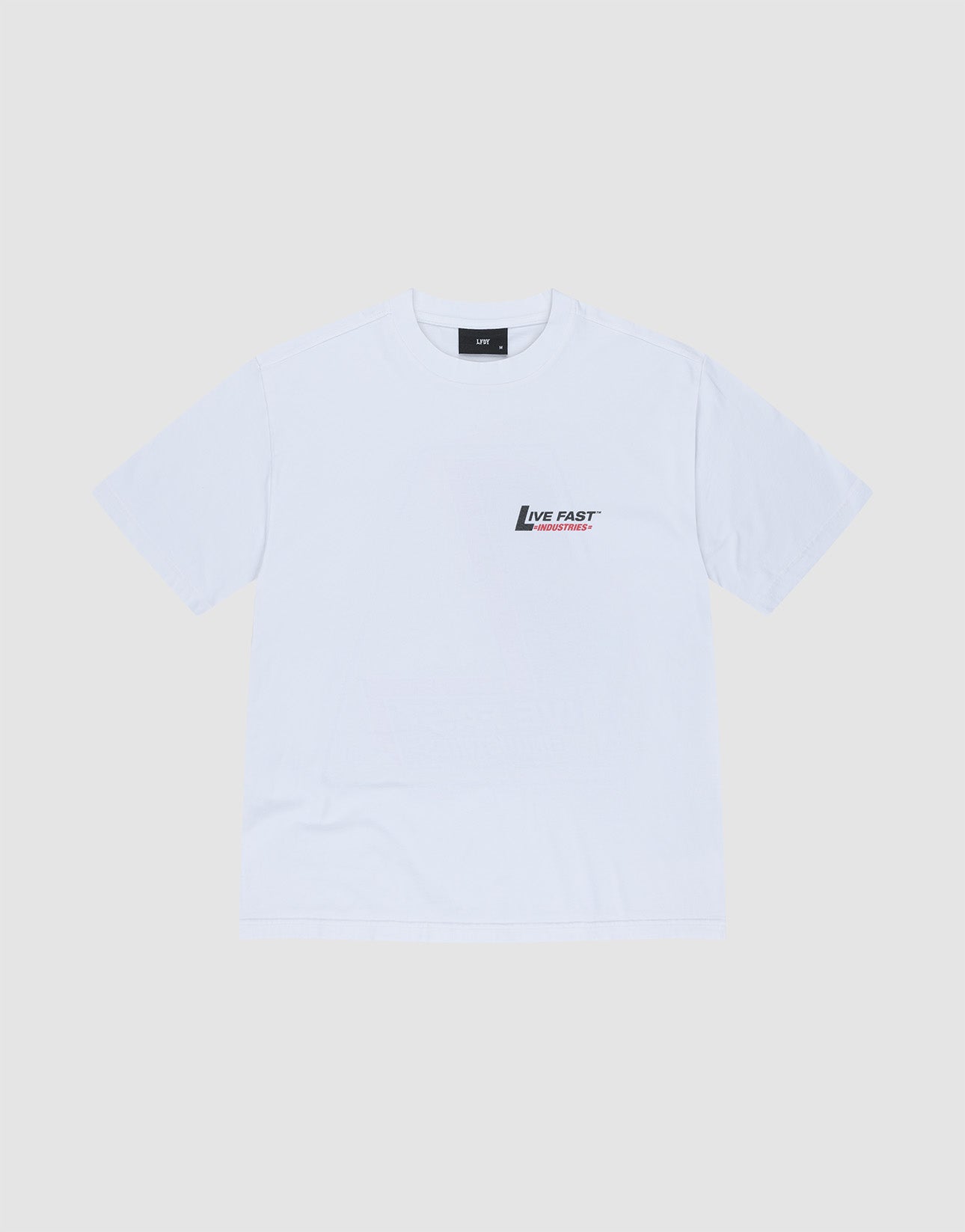 The LFDY Industries Tee by LIVE FAST DIE YOUNG is a plain white oversized short-sleeve t-shirt, made from 100% cotton, featuring a small black and red Live Fast logo and text on the left chest, shown on a light grey background.