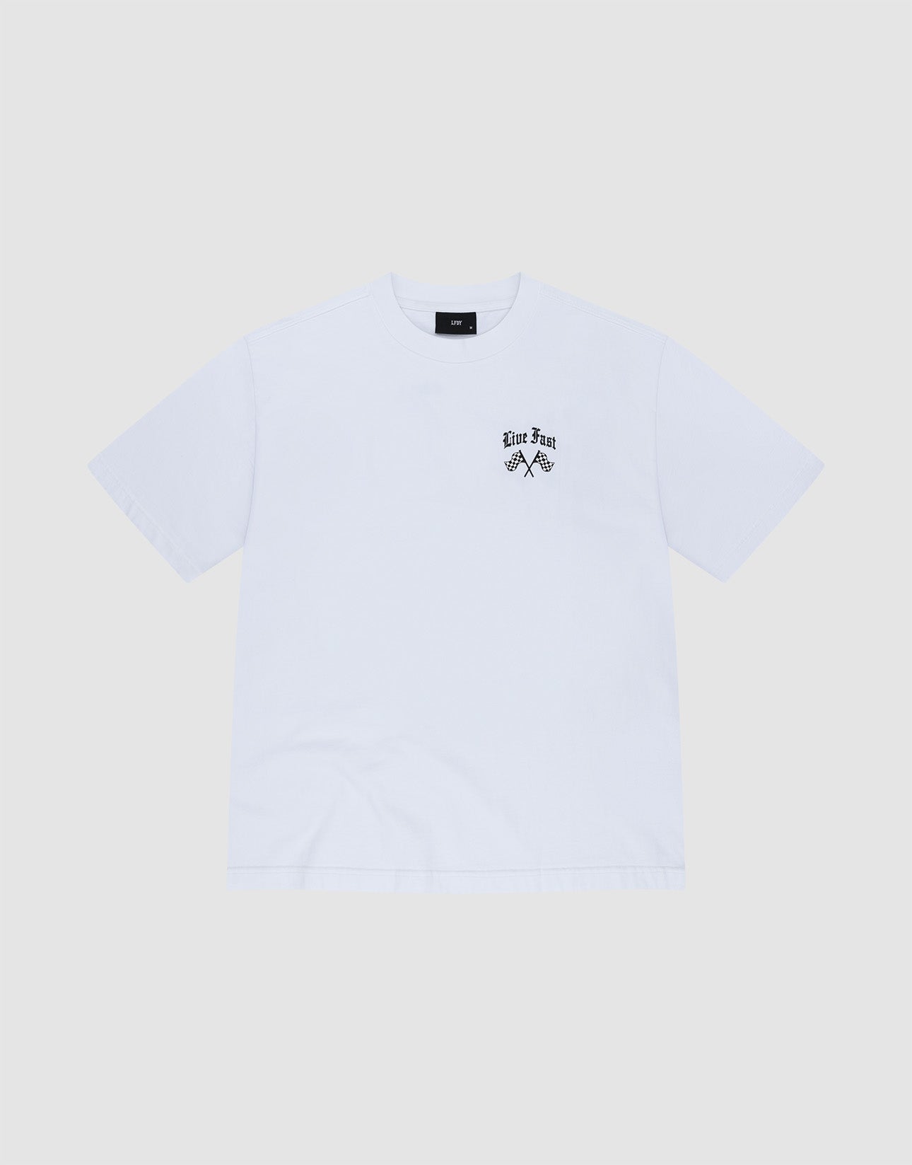 The LFDY Haters Tee by LIVE FAST DIE YOUNG is a plain white short-sleeve shirt with a small black graphic and "Live Fast" text on the left chest, made from 100% Baumwolle, shown on a light gray background.