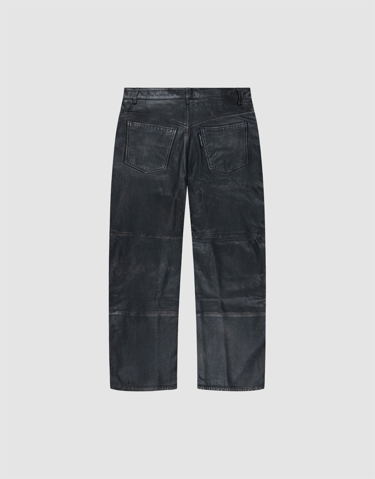 The Baggy Leather Pants by LIVE FAST DIE YOUNG are shown from the back in black sheep leather, with two rear pockets and a straight leg, set against a plain light gray background.