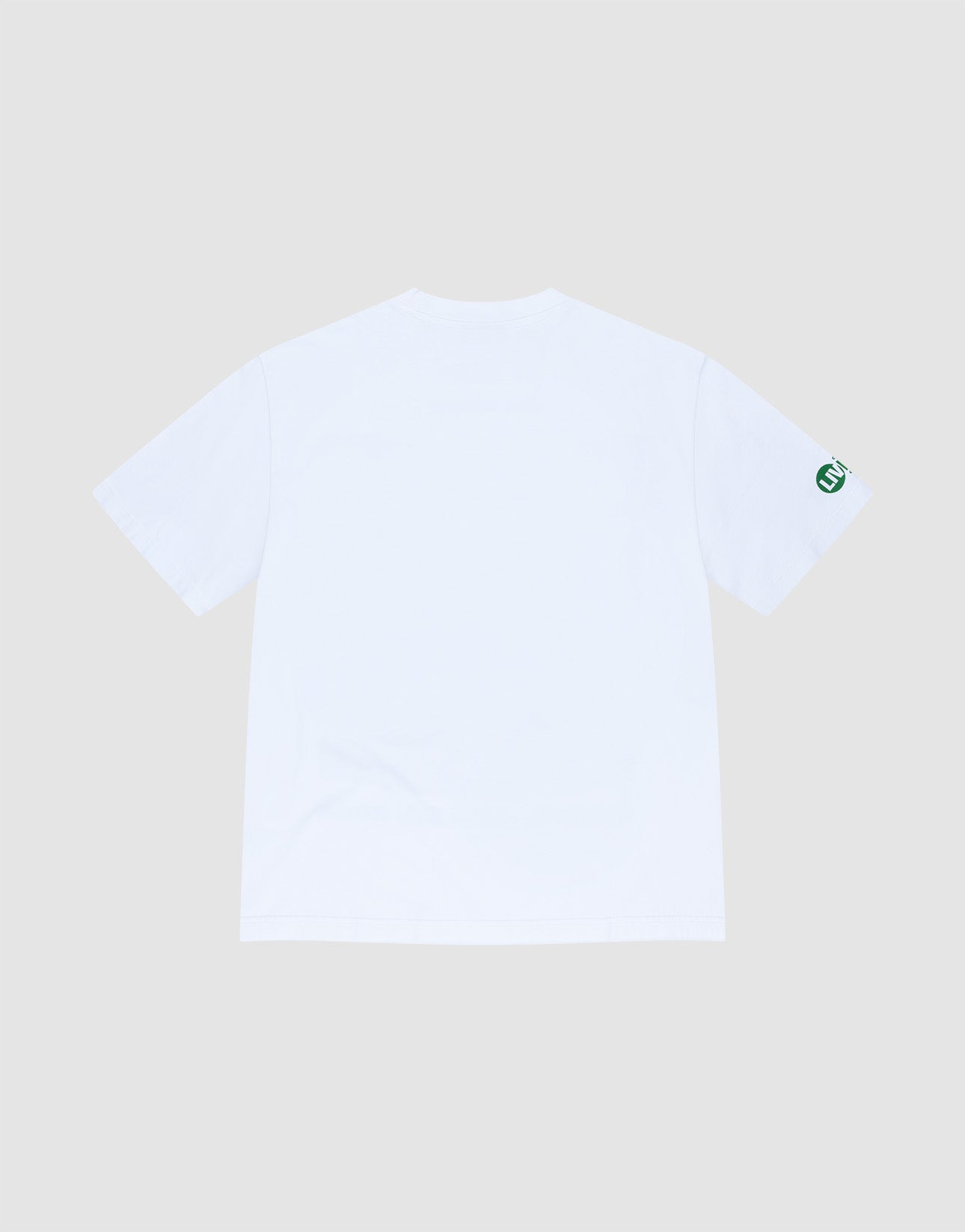 The LIVE FAST DIE YOUNG LFDY Metro Boomin Tee, shown from the back against a light gray background, is an oversized white short-sleeve shirt made of 100% Baumwolle, featuring a small green circular logo on the left sleeve.