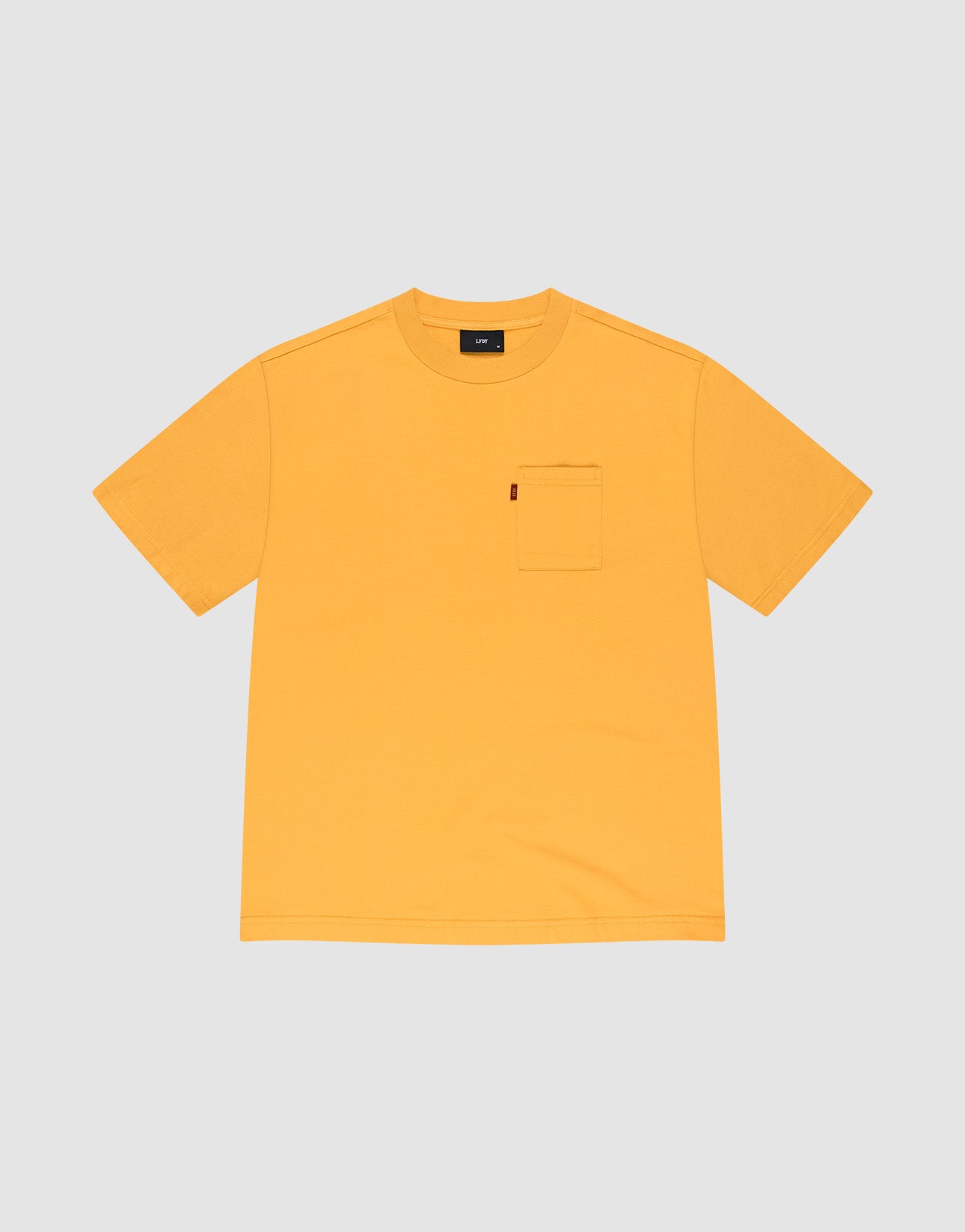 The LFDY Tube Pocket Tee by LIVE FAST DIE YOUNG is a plain yellow short-sleeve shirt with a left chest pocket, crafted from 100% Baumwolle, shown on a light gray background.