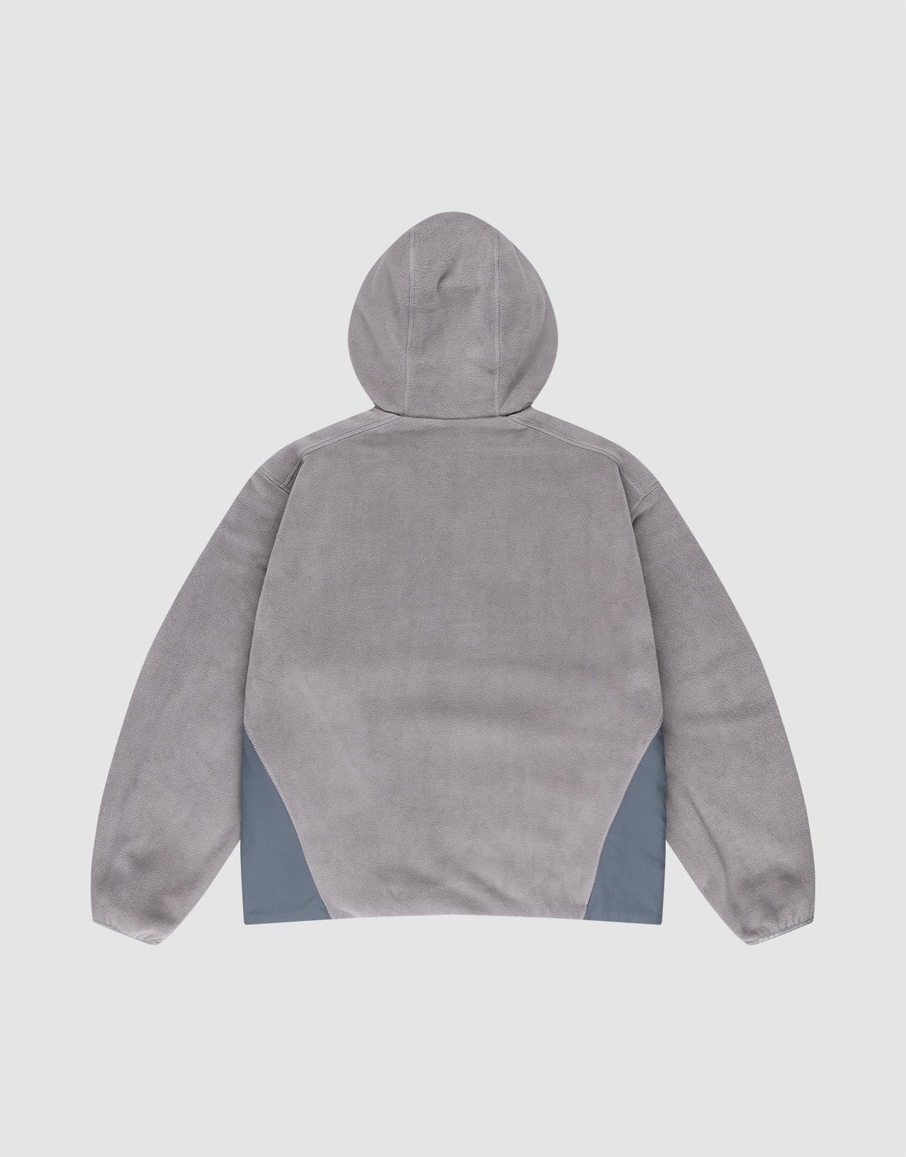 Back view of the LIVE FAST DIE YOUNG Live Fast Fleece Halfzip in light gray, featuring an oversize fit, long sleeves, and dark gray nylon triangular panels at the lower sides, made from polyester on a plain white background.