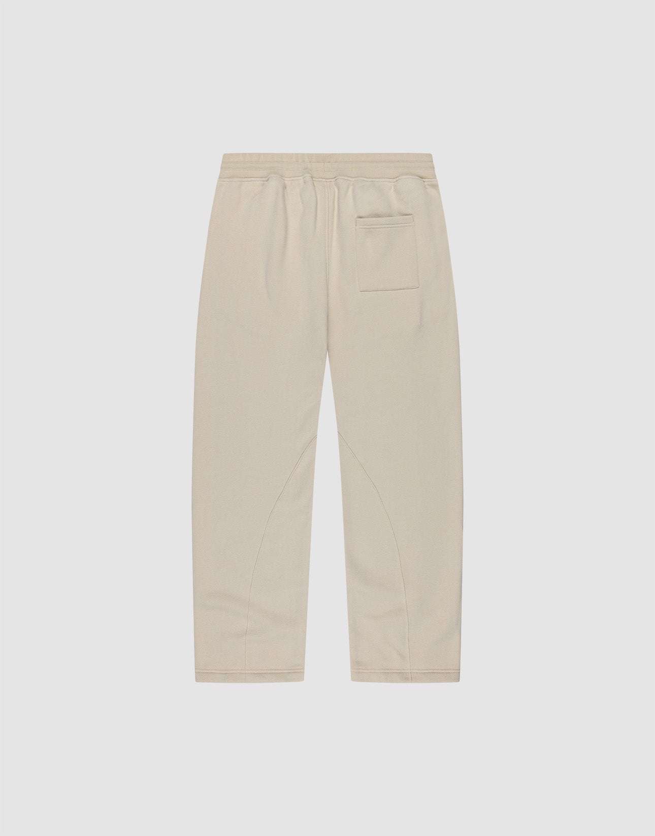 Die LFDY Pleated Jogger von LIVE FAST DIE YOUNG ist eine beigefarbene Hose mit weitem Schnitt, Elastikbund und einer Gesäßtasche, flach auf weißem Hintergrund präsentiert.