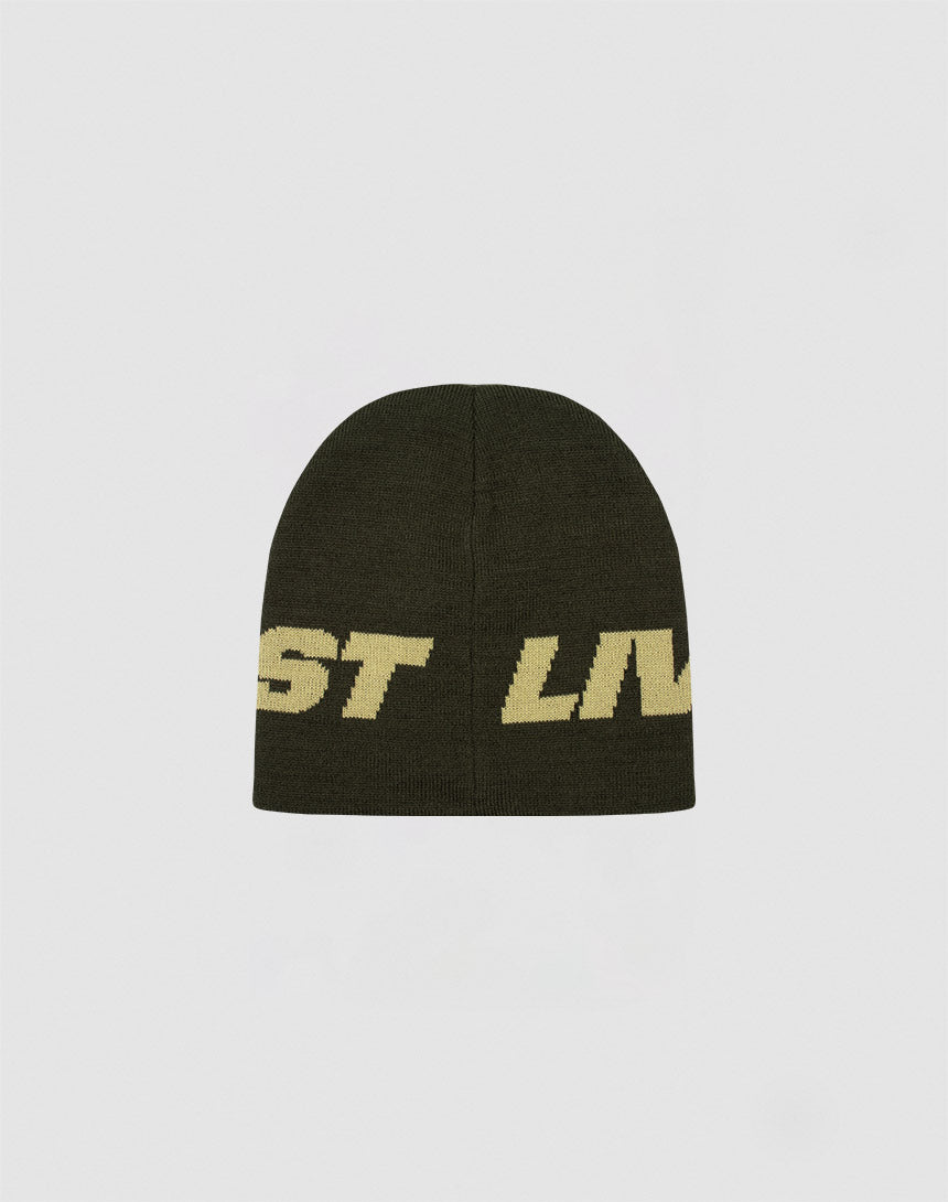 The Live Fast Jacquard Beanie by LIVE FAST DIE YOUNG is a dark green Polyacryl knit hat featuring bold yellow ST LIV jacquard lettering, shown against a plain light gray background.