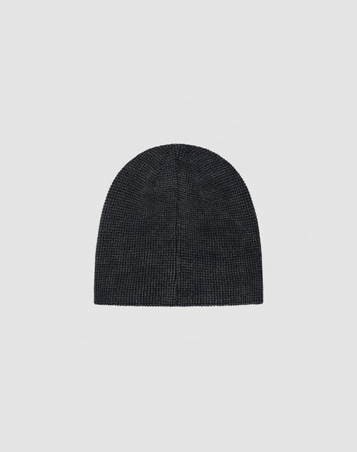 The DY Waffle Beanie by LIVE FAST DIE YOUNG, a plain, dark knit hat made from 100% Baumwolle, is shown against a light gray background.