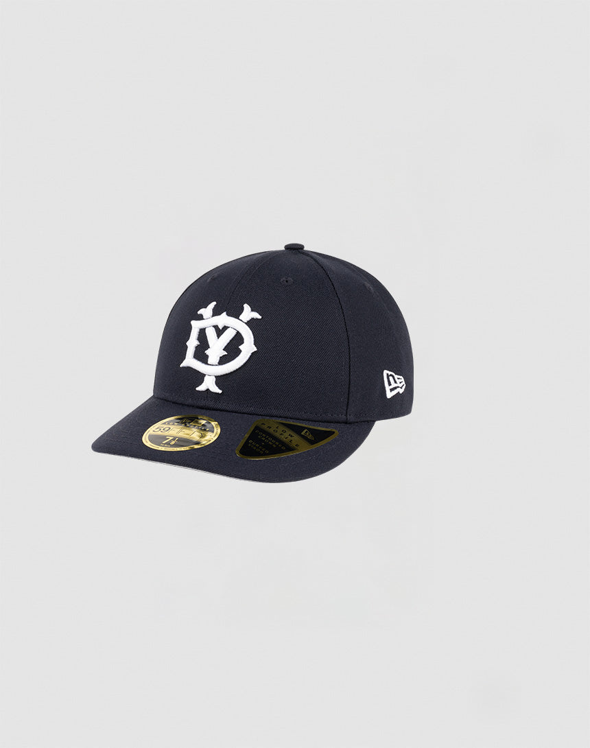 The LFDY x NEW ERA 59FIFTY Low Profile fitted cap by LIVE FAST DIE YOUNG features a black design with a white D and Y front logo, brim sticker, and New Era side logo, shown against a light gray background.