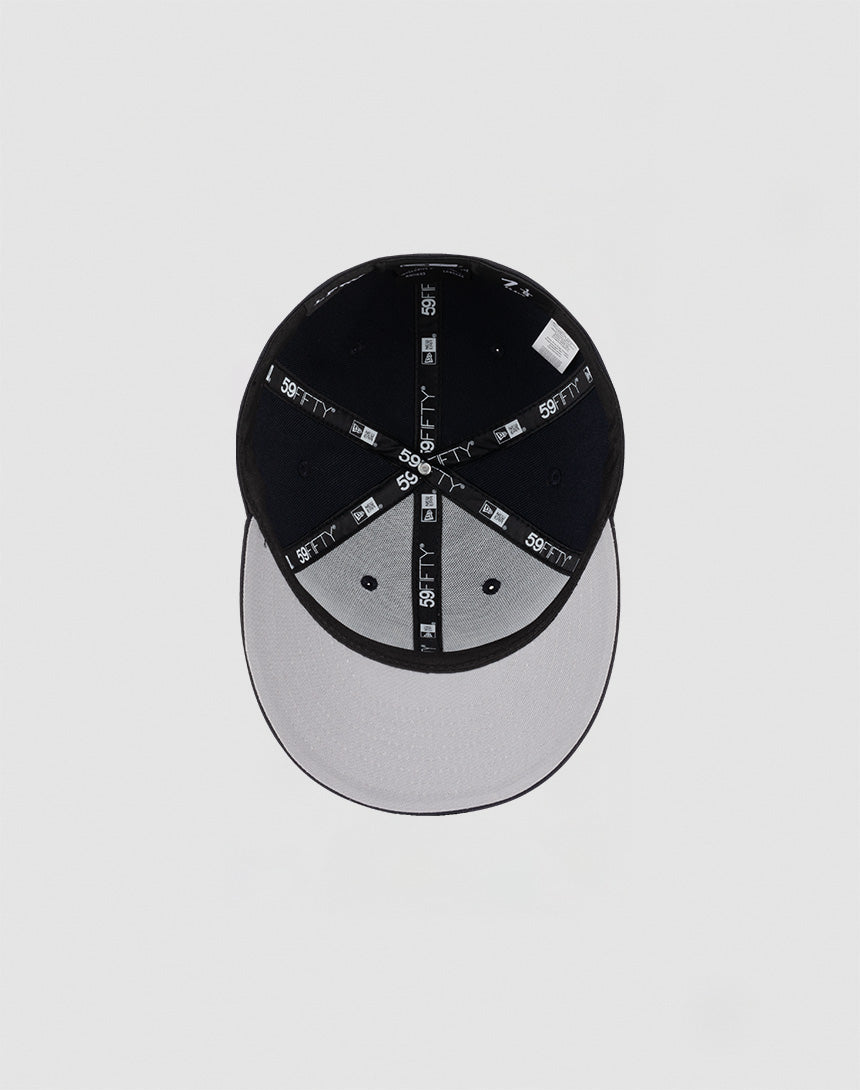 A top-down view of the LFDY x NEW ERA 59FIFTY Low Profile Fitted Cap by LIVE FAST DIE YOUNG, featuring black seams, a black crown, and a gray brim against a plain light background.