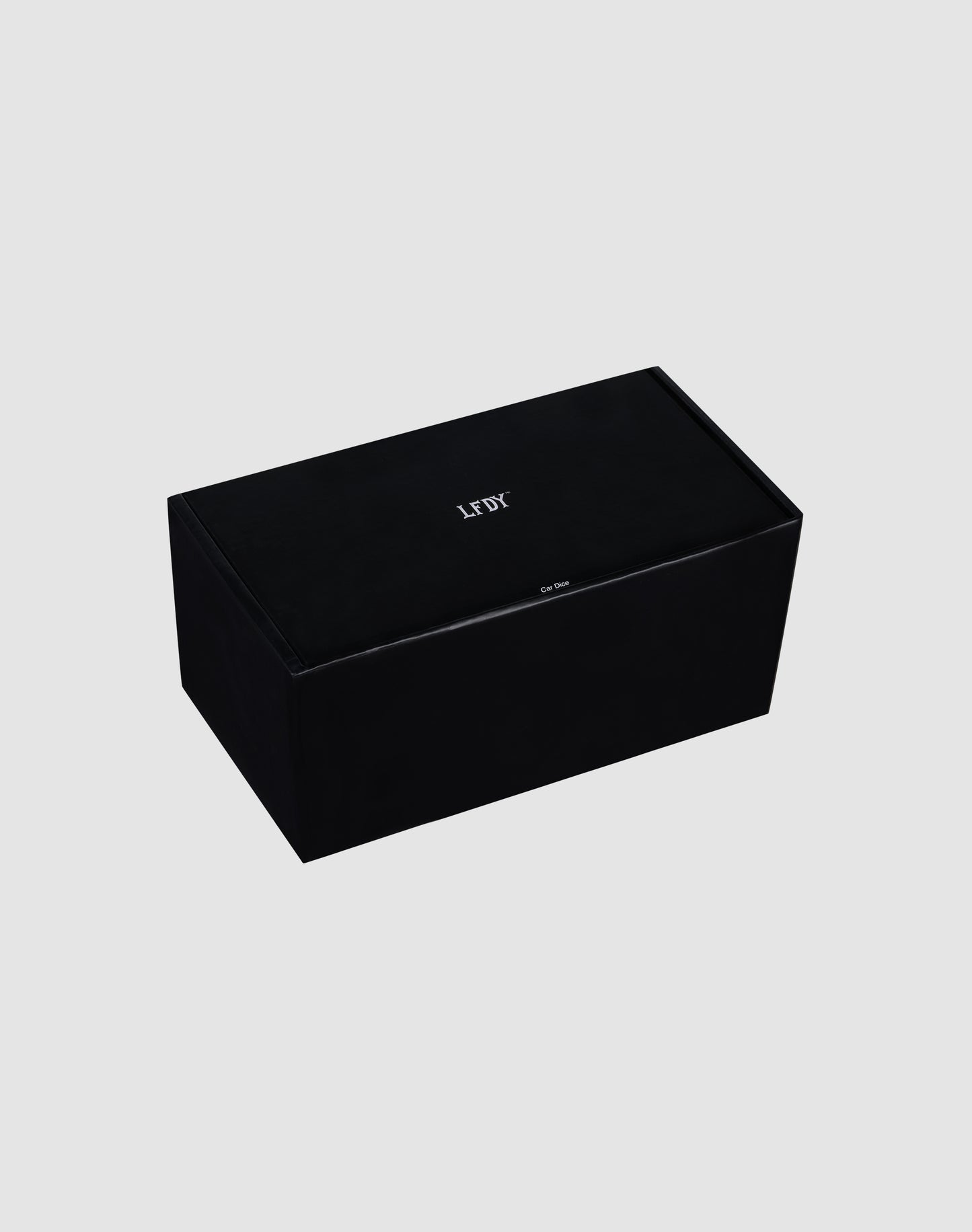 A rectangular black LFDY Leather Car Dice by LIVE FAST DIE YOUNG, featuring "LEFT" in white on top, displayed on a plain light gray background.