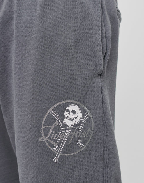 Close-up of the Live Fast Skull Sweat Jogger by LIVE FAST DIE YOUNG in gray Regular Fit, featuring a white graphic with baseball, bat, skull, and Live Fast text. Made from soft Baumwolle for all-day comfort.