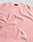 The LFDY Knit Sweater by LIVE FAST DIE YOUNG is shown laid flat in pink and white with a ribbed texture, dropped shoulders, and a small beige "Live Fast" patch near the hem. The neck tag is also visible.