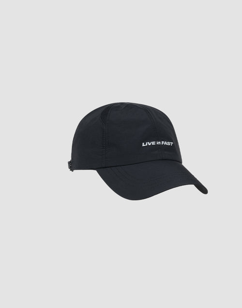 The Live Fast Performance Cap by LIVE FAST DIE YOUNG is a black, adjustable nylon baseball cap featuring LIVE FAST embroidered in white on the front, shown against a plain light gray background.