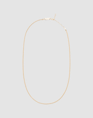 The LIVE FAST DIE YOUNG Round Box Chain is a thin gold necklace crafted from 925 vergoldet Sterling Silber, featuring a lobster clasp and small extender for an adjustable length, shown against a plain light gray background.