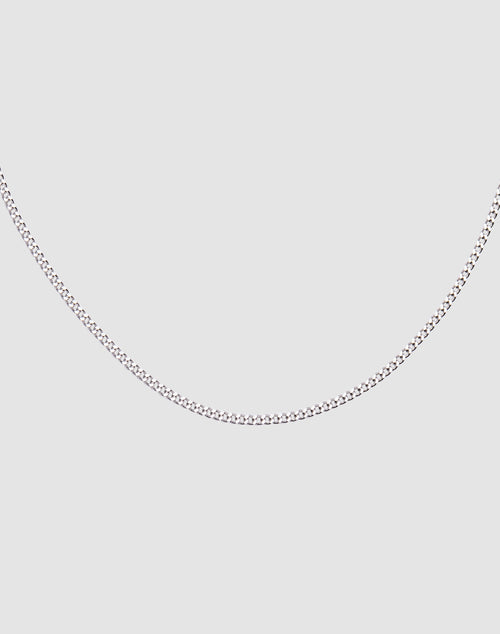The LIVE FAST DIE YOUNG Round Box Chain, a slim 925 Sterling Silver necklace with adjustable length, is displayed on a plain light gray background and forms a gentle curve.