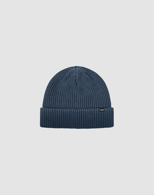 The LIVE FAST DIE YOUNG Double Rib Knit Beanie is blue with doppellagig gestricktem Design for a voluminöser Look, featuring a folded brim and small black front tag, shown on a plain light gray background.