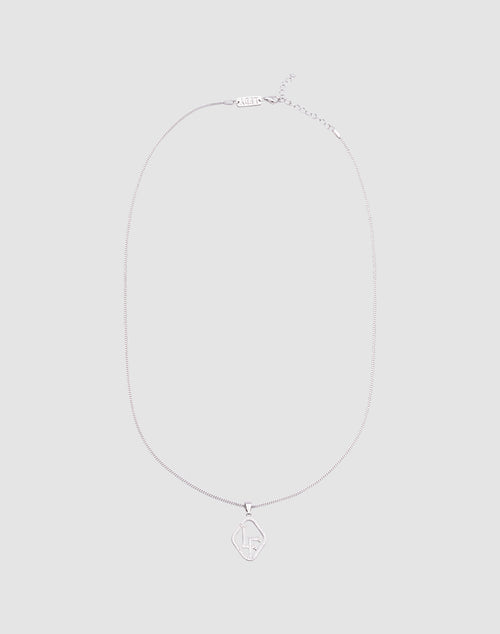The LF Chain by LIVE FAST DIE YOUNG is a delicate Sterling Silber Kette with a diamond-shaped Zirkonia Anhänger engraved with LF in the center, shown on a light gray background and featuring verstellbare Länge for a perfect fit.