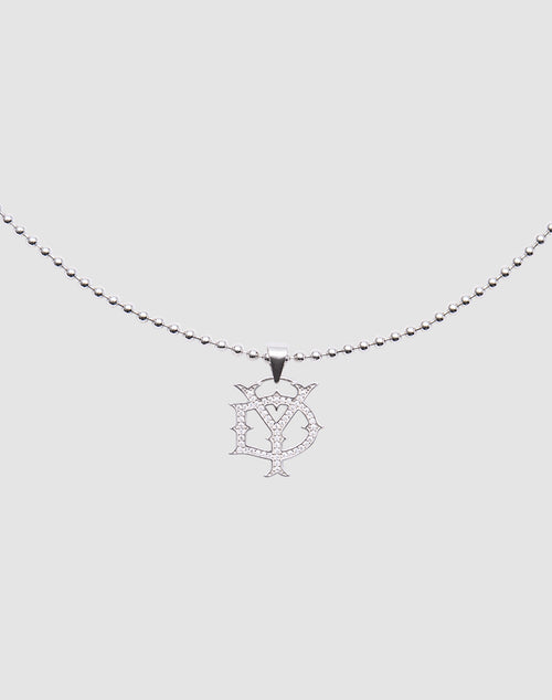 The DY Chain by LIVE FAST DIE YOUNG is a silver beaded necklace with a stylized D and Y pendant, encrusted with sparkling zirconia stones, crafted from sterling silver, shown on a plain light gray background.