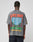 Someone wearing an oversize gray LFDY Metro Boomin Tee by LIVE FAST DIE YOUNG, featuring colorful back text: LIVE FAST, Main Event, METRO BOOMIN, Sunday, June 23, 2024, and an image of the Gateway Arch with trees.