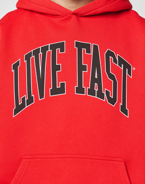 A close-up of the LIVE FAST DIE YOUNG Live Fast College Hooded, an Oversize Fit red hoodie with bold, black arched LIVE FAST lettering on the chest, made from soft Baumwolle and polyester for comfort and style.