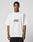 A person stands facing forward in the LIVE FAST DIE YOUNG Fuck Die Young Tee, a loose white T-shirt with an edgy front print, set against a plain light gray background.