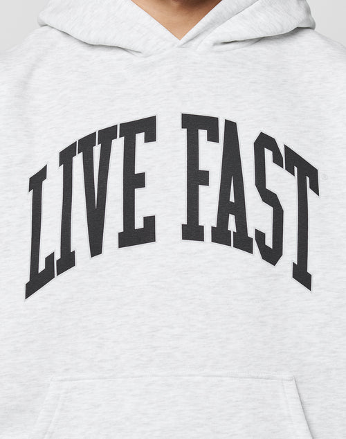 The Live Fast College Hooded by LIVE FAST DIE YOUNG is a light gray oversized hoodie with LIVE FAST boldly printed in black across the chest.