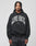 A man with short dreadlocks wears the LIVE FAST DIE YOUNG Live Fast Axe Hooded, an oversize black Baumwolle-Polyester hoodie with bold white LIVE FAST text, standing against a plain light gray background.