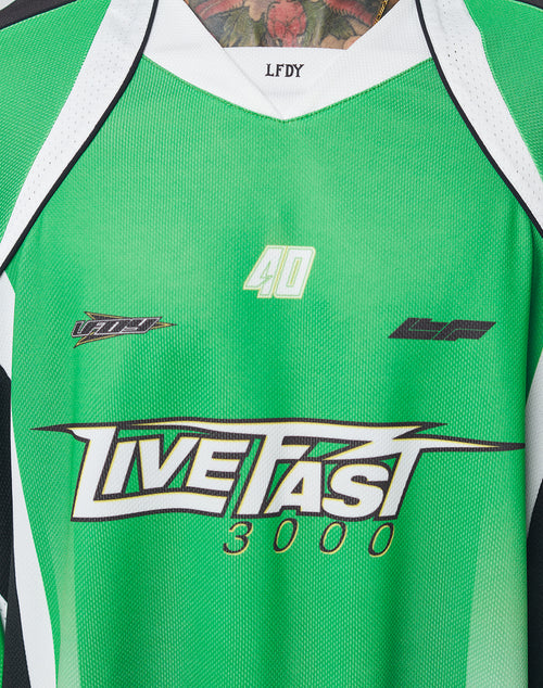 The LFDY Motorcross Jersey by LIVE FAST DIE YOUNG is an oversized green and white sports top with multi-logo prints, LIVE FAST 3000 and the number 40 on the chest, LFDY on the collar, and crafted from 100% polyester.