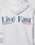 Someone wears an oversized, light gray LIVE FAST DIE YOUNG Live Fast Paris Hooded, featuring bold blue “Livé Fast™” with a red underline and accented "e" on the back, plus front and back prints.