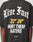 Wearing the LFDY Haters Tee by LIVE FAST DIE YOUNG: an oversize black cotton shirt with bold “Live Fast, 22 24, Hurt Them Haters” in white and yellow on front and back, finished with two small checkered flags at the bottom.