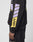 A person wears the LFDY Racing Hooded by LIVE FAST DIE YOUNG—an oversize black sweatshirt with lavender and yellow glossy LFDY designs on the sleeve. Their hand is visible against a plain light gray background.