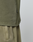 Close-up of a person wearing the olive green LIVE FAST DIE YOUNG Basic 210 Tee, made from 100% Baumwolle. The image shows only the midsection, highlighting the fabric texture and a small black tag on the side seam against a plain background.