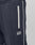 Close-up of the navy blue Live Fast Trackjogger by LIVE FAST DIE YOUNG in Regular Fit, with a vertical white zippered pocket, white piping, and LIVE FAST embroidered below the pocket for a sporty logo detail.