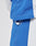 Close-up of a person wearing the LFDY Trackjacket 3000 by LIVE FAST DIE YOUNG in blue and white, showcasing a white circular plastic toggle on the adjustable waist cord. The background is plain and light-colored.