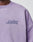 A person wears a light purple Basic Purple Sweater by LIVE FAST DIE YOUNG. Only the upper torso and part of the neck are visible.