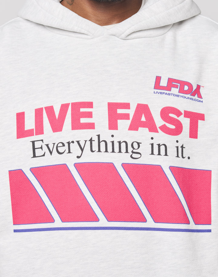 A close-up of the LFDY Racing Hooded by LIVE FAST DIE YOUNG in light gray Oversize Fit, featuring bold red and black LIVE FAST Everything in it. text, LFDA logo above, glossy print, and blue-outlined red diagonal shapes.