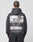 A person with short hair is seen from behind wearing the LIVE FAST DIE YOUNG LFDY Cinema Hooded in Oversize Fit, featuring a bold eye graphic, the words LIVE FAST, country names, and garment details on the back.