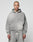 A person with a shaved head and neck tattoos models the LIVE FAST DIE YOUNG Basic Hooded Zip in gray, along with matching sweatpants, standing against a plain light background and looking at the camera.