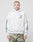 A person in a light gray LIVE FAST DIE YOUNG Rhine Area Hooded hoodie with sleeve and chest graphics, paired with camouflage cargo pants, stands against a plain white background.