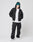 A person stands with hands in pockets against a plain light background, wearing the LIVE FAST DIE YOUNG LF Vulgar Hooded Zip in black with a white t-shirt, black cargo pants, teal beanie, and white sneakers.