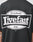 A person wears the LFDY Bulge Tee by LIVE FAST DIE YOUNG, an oversize black cotton T-shirt with a white rectangular graphic on the back that reads Everybody Livefast Eats LFDTM; only the back print and part of their arm are visible.