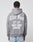 A person faces away, wearing a LIVE FAST DIE YOUNG LFDY Haters Hooded in oversize gray, featuring Live Fast, 22 24, and Hurt Them Haters boldly printed on the back in white and light blue.